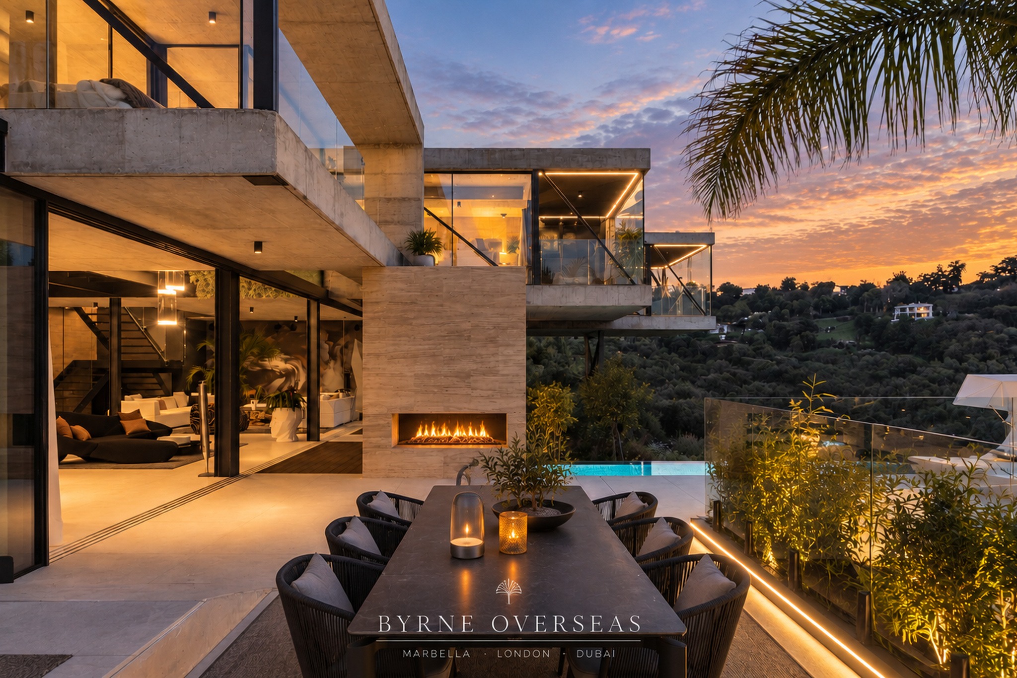 Casa Flotante terrace with outdoor fire and pool at dusk, Marbella Club Golf Resort